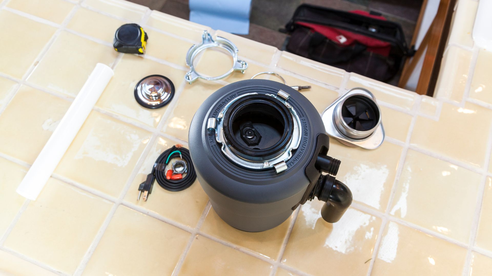 A camera lens sitting on top of a tiled counter